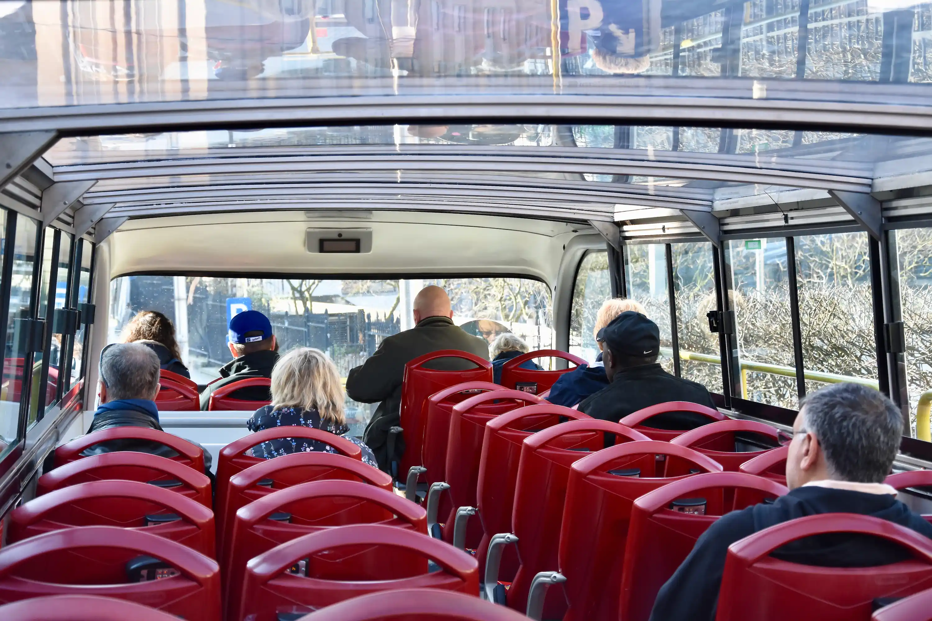 Hop On Hop Off Baku Upper Deck Upper deck interior of the Baku city tour bus with travelers onboard.