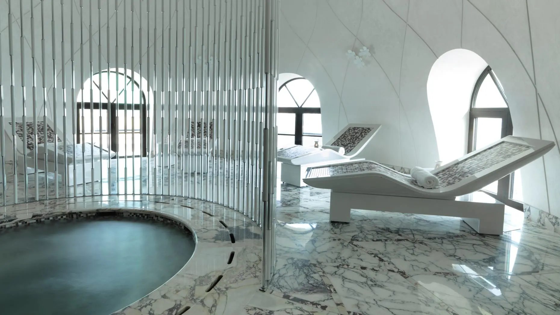 Four Seasons Hotel Spa The indoor spa at Four Seasons Hotel Baku with heated lounge chairs and a whirlpool.