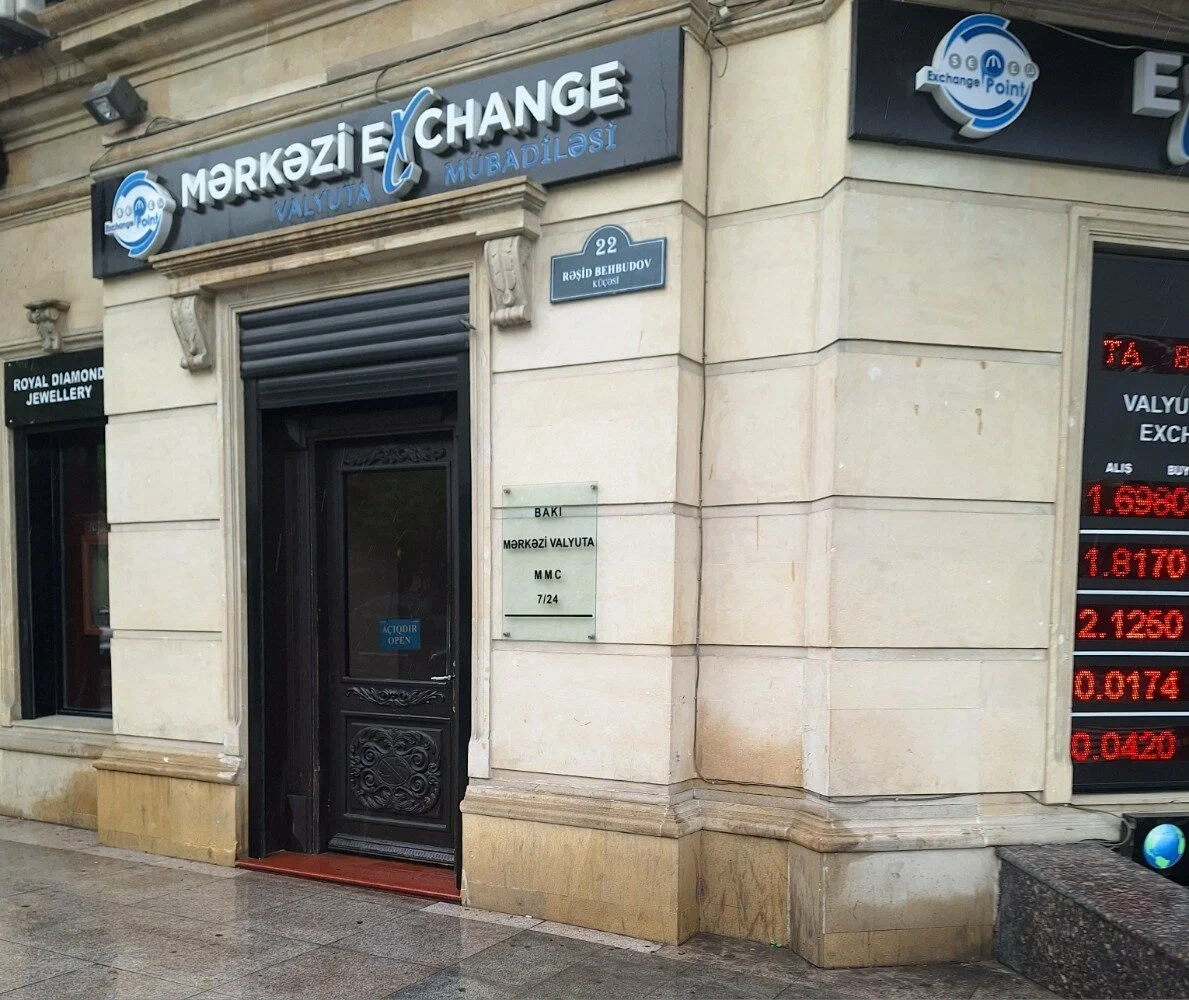 Merkezi Currency Exchange Baku Merkezi Exchange on Rashid Behbudov Street on a rainy day.